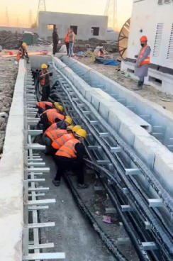 more people pulling cables by hand